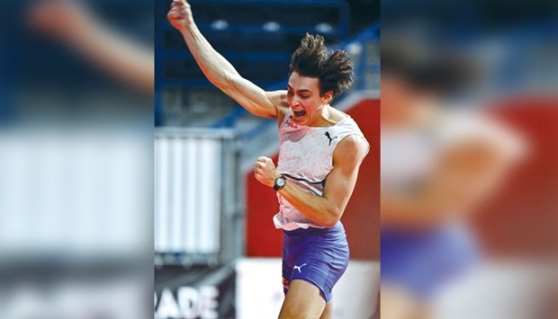 Armand Duplantis celebrates after breaking his own pole vault world record at the Belgrade Indoor Meeting on Monday. (AFP)