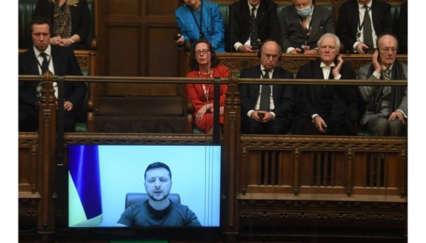 MPs in UK Parliament listening to Ukraine's President Volodymyr Zelensky speaking to them by live video-link in the House of Commons, in London, on March 8. AFP/Jessica Taylor/UK Parliament.