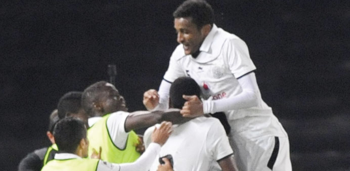 Al Sadd players celebrating after defeating Al Arabi in their Qatar Stars League match yesterday.