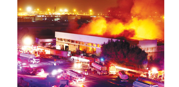 Fire raging in a warehouse on Street Number 2 of Dohau2019s Industrial Area yesterday evening. PICTURE: Jayan Orma.