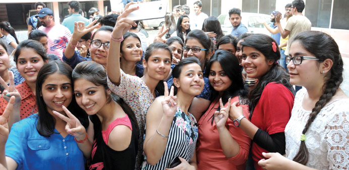 Students celebrate after the results of Class 12 exams were declared in Amritsar yesterday.