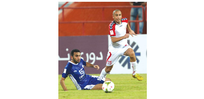 Maher Haddad of Al Shamal gets past Mohamed Yasser of Al Kharatiat in their Qatar Stars League match yesterday.