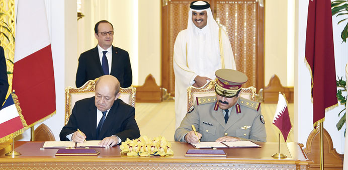  HH the Emir Sheikh Tamim  and President Hollande witnessing the signing of an agreement yesterday.