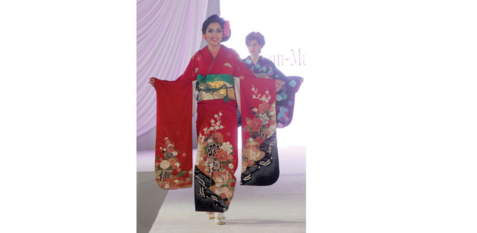  COLOURS OF JAPAN: Bright red adorns the ramp during the fashion show at The St. Regis Doha.                 Photo by Shemeer Rasheed