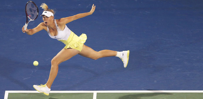 Caroline Wozniacki of Denmark in action against Czech Republicu2019s Lucie Safarova during their WTA Dubai Open match in Dubai yesterday. (AFP)