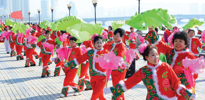 Members of a yangko dance team in Jilin perform by the street to celebrate the lanternu2019s festival.