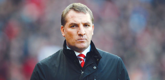 Liverpool manager Brendan Rodgers arrives to attend the EPL match against Manchester United at Old Trafford in Manchester.