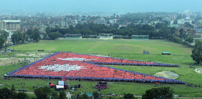 An aerial view of the Nepalese national flag, formed by over 35,000 people, is seen at the Tudikhel open ground in central Kathmandu yesterday.