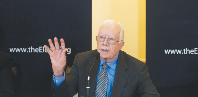 Jimmy Carter speaks during a news conference in Yangon yesterday.