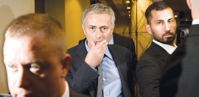 Chelsea manager Jose Mourinho (centre) leaves after a press conference at Stamford Bridge in London, on Monday. (AFP)