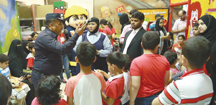 A Civil Defence official speaks on fire safety.