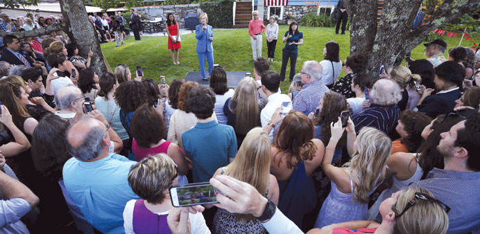 Clinton speaks during a campaign stop in a backyard of a home in Windham, New Hampshire on Thursday.