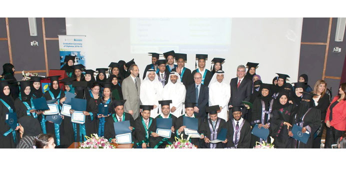 Diploma graduates pose for a group photo alongside Mohamed Mubarak al-Noimi and Dr Khalid Abdul Hadi.