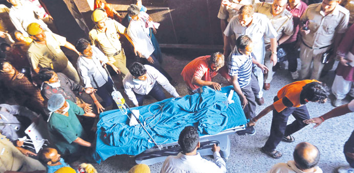 The victim is moved to the All India Institute of Medical Sciences hospital from Swami Dayanand hospital for treatment in New Delhi yesterday.