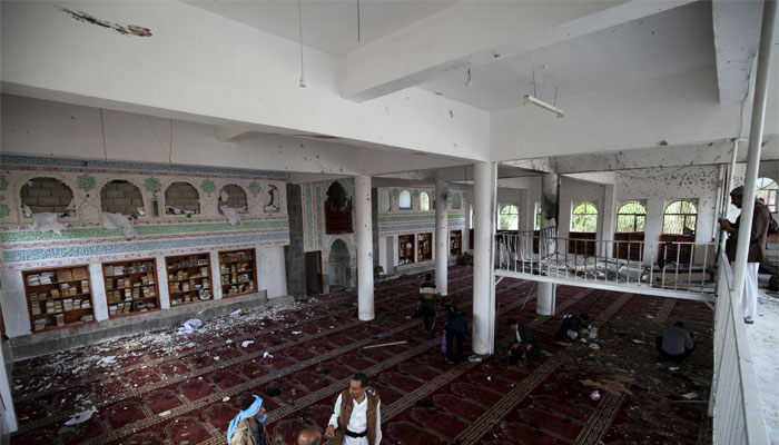 Houthi militants are seen after a suicide bomb attack at a mosque in Sanaa. Reuters