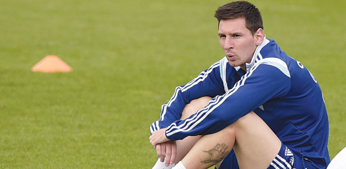 Argentinau2019s forward Lionel Messi attends a training session at the Cidade do Galo base camp in Vespasiano near Belo Horizonte.  (AFP). 
