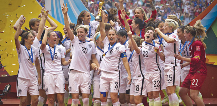 USA players celebrate after winning the 2015 FIFA Womenu2019s World Cup in Vancouver, Canada on Sunday. (AFP).