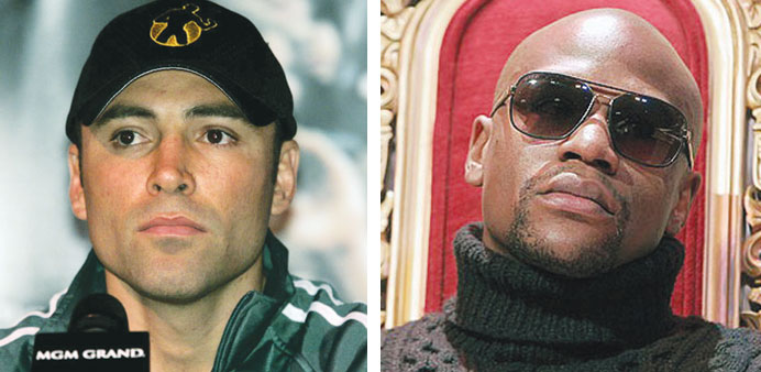 Oscar De La Hoya  and Floyd Mayweather