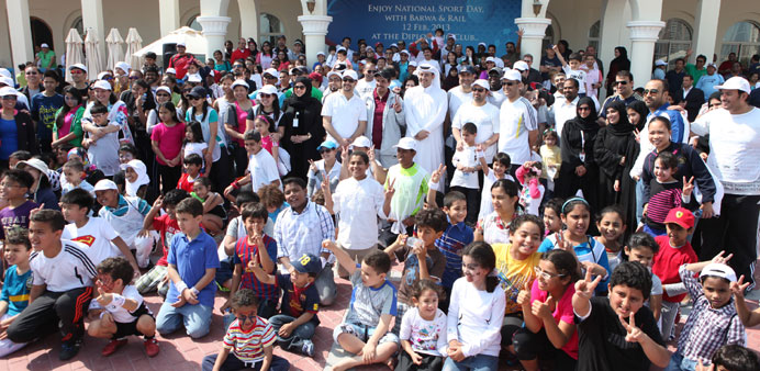 Employees and their families celebrate National Sport Day organised jointly by Qatar Rail and Barwa.