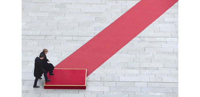 Merkel and Tsipras attend a welcoming ceremony at the chancellery in Berlin.
