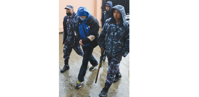  Police escort Ernest Fenwick MacIntosh accused of sexually abusing a Nepalese child, ahead of a final hearing at a district court in Lalitpur, near K