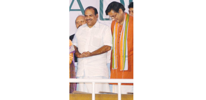 Balakrishnan is seen with Congress MP Shahshi Tharoor at an event.