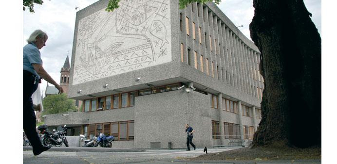 People pass Picassou2019s mural art work u2018The Fishermanu2019 on u2018Y buildingu2019 in Oslo.