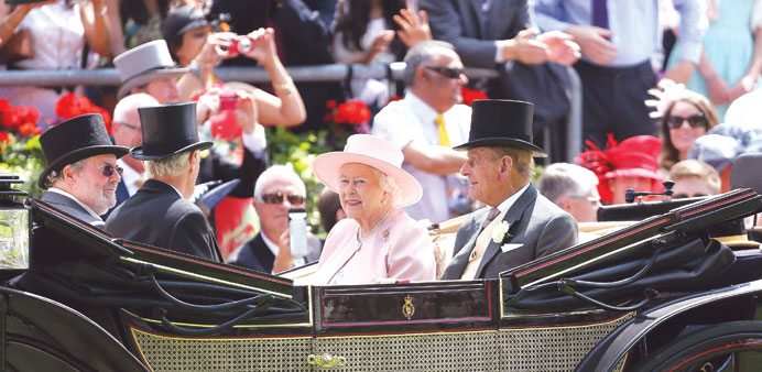 Queen Elizabeth and Prince Philip attend the last day of the Royal Ascot horse racing festival at Ascot.