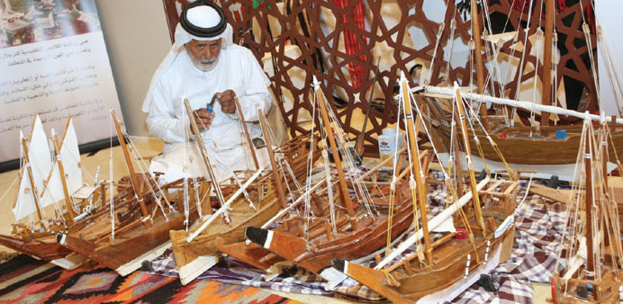 Miniature dhows showcased at the exhibition.