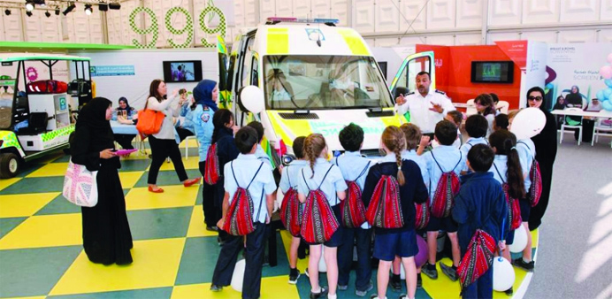 Schoolchildren being briefed by Ambulance Service paramedic