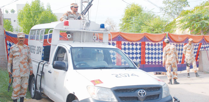 Pakistani Rangers seal the scene of a bomb blast that targeted the office spy agency Inter Services Intelligence, in Sukkur.