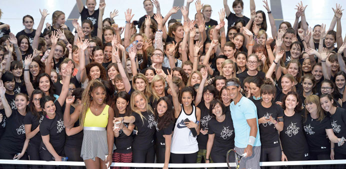 Serena Williams (left) and Rafael Nadal pose with the participants of the u2018We own the nightu2019 10 km womenu2019s marathon in Paris. (AFP)