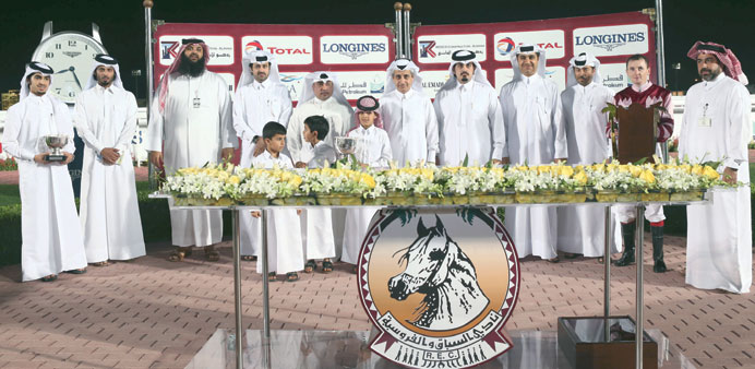 Qatar Cancer Society Chairman of Board of Directors Dr Khalid bin Jabor bin Mohammed al-Thani is seen with the winners of the Balhambar Cup at the QRE