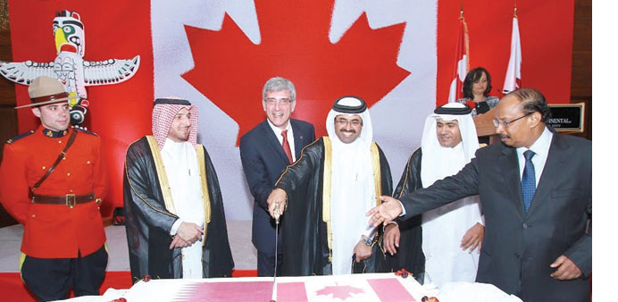  HE the Minister of Energy and Industry Dr Mohamed bin Saleh al-Sada with Canadian Ambassador Andru00e9 Dubois and other officials and dignitaries at the 