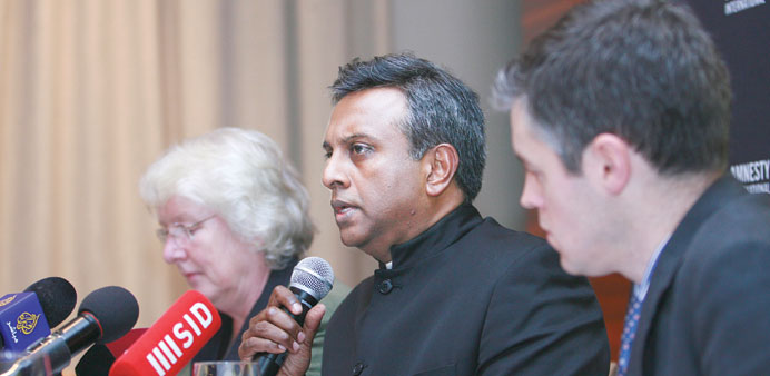 Amnesty International (AI) secretary general Salil Shetty addressing the press conference yesterday as AI experts James Lynch and Nicola Duckworth loo