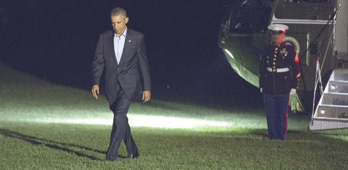 US President Barack Obama walking from Marine One after returning from the Nato summit in Wales, at the White House in Washington.