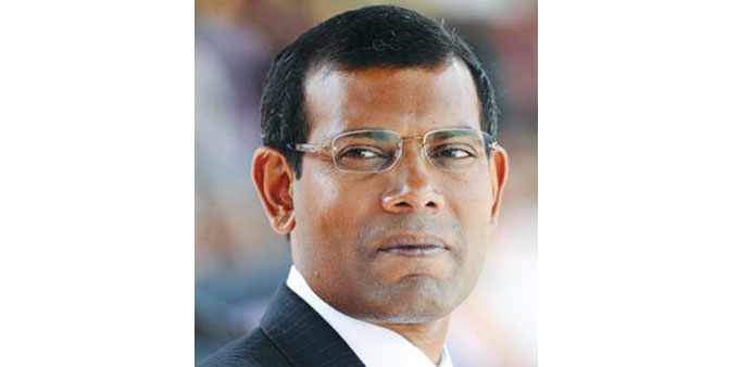 Mohamed Nasheed refuses to enter the courtroom for the first hearing to protest it not being open to the public.