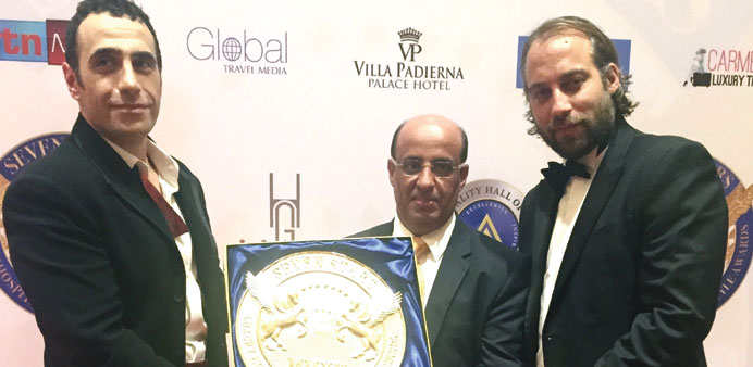 A Katara official and other dignitaries with the award.