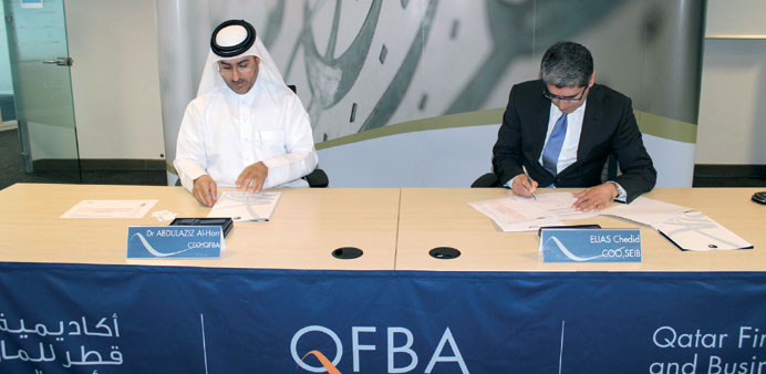 Dr Abdulaziz al-Horr and Elias Chedid signing the MoU.