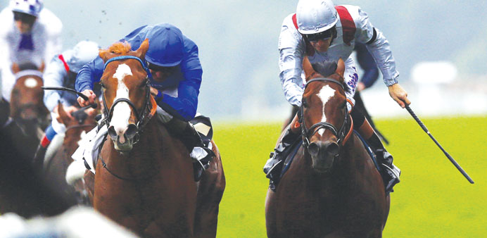 Kevin Manning (left) on his mount Dawn Approach races to win the St Jamesu2019s Palace Stakes on the first day of the Royal Ascot horse racing festival ye