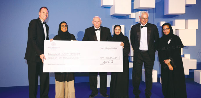 The winning filmmaker in the Best Picture category with NU-Q and Thimun Qatar officials.