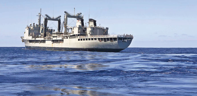 A handout picture made available by the Australian Department of Defence (DOD) shows the HMAS Success searching for the missing aircraft, at sea in th