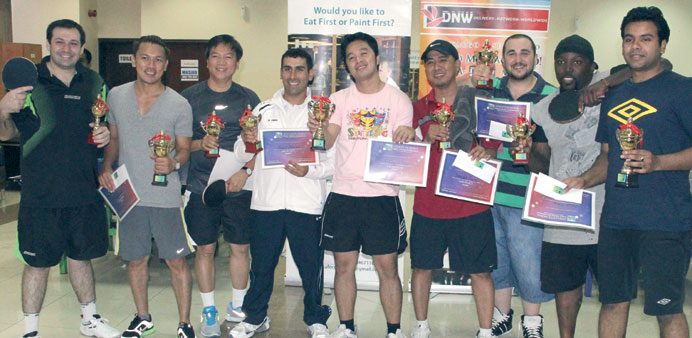The winners with their trophies.