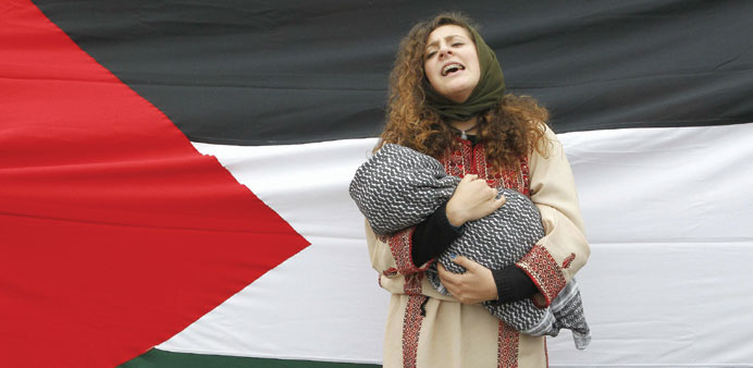 A member of the Palestine community during a rally in Valparaiso, northwest of Santiago.