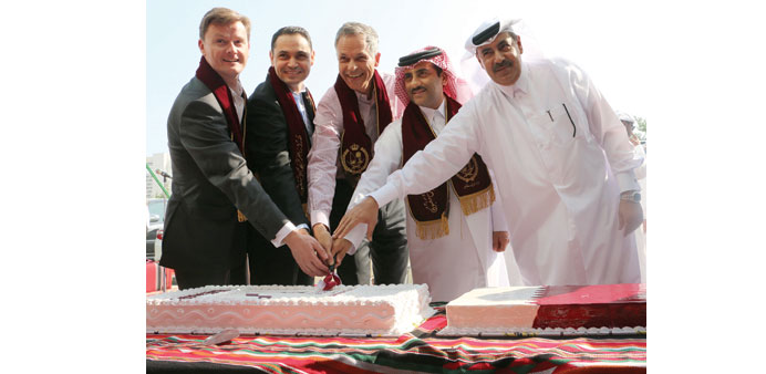 Officials cutting a cake on the occasion.