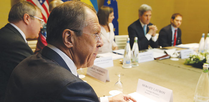 Lavrov listening during the meeting in Geneva.