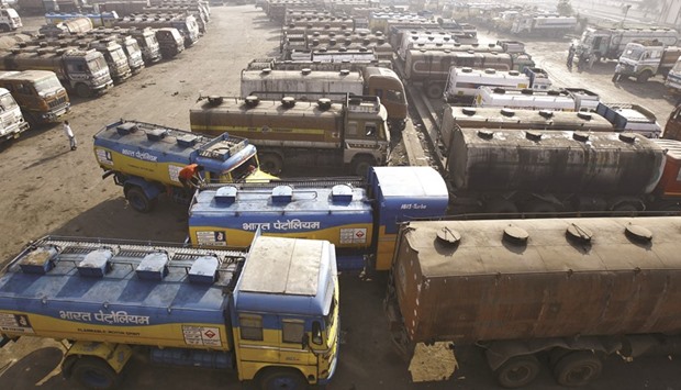 Oil tankers are seen parked at a yard outside a fuel depot on the outskirts of Kolkata. India, Asiau2019s third-biggest economy, consumed 4mn barrels of oil last year, according to the International Energy Agency, and is expected to surpass Japan as the worldu2019s third-largest oil user this year. The country will be the fastest-growing crude consumer in the world through 2040, according to the IEA, adding 6mn barrels a day of demand, compared to 4.8mn for China.