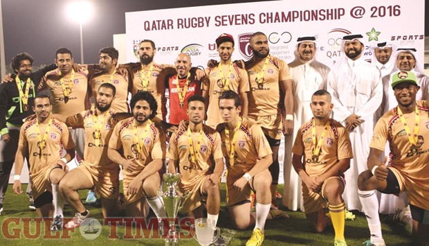 QRF president Yousef al-Kuwari and QRF secretary general Ali al-Malki with the Camels 1 team after they won the final against DRFC Hurricanes (top right) yesterday. PICTURES: Nasar TK