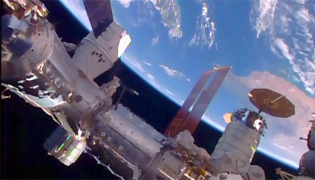 NASA TV image shows SpaceX's unmanned Dragon cargo ship docked at the International Space Station