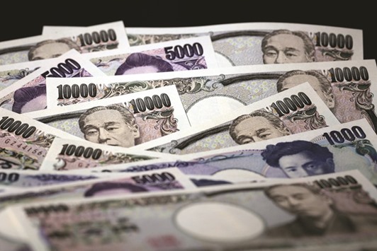 Japanese yen banknotes of various denominations are arranged for a photograph in Tokyo. The yen advanced to 107.67 last week, the strongest since before the central bank expanded monetary stimulus in October 2014, despite efforts by officials to talk it down.